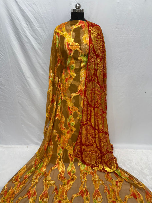 Colorful embroidered fabric draped over a mannequin against a white background