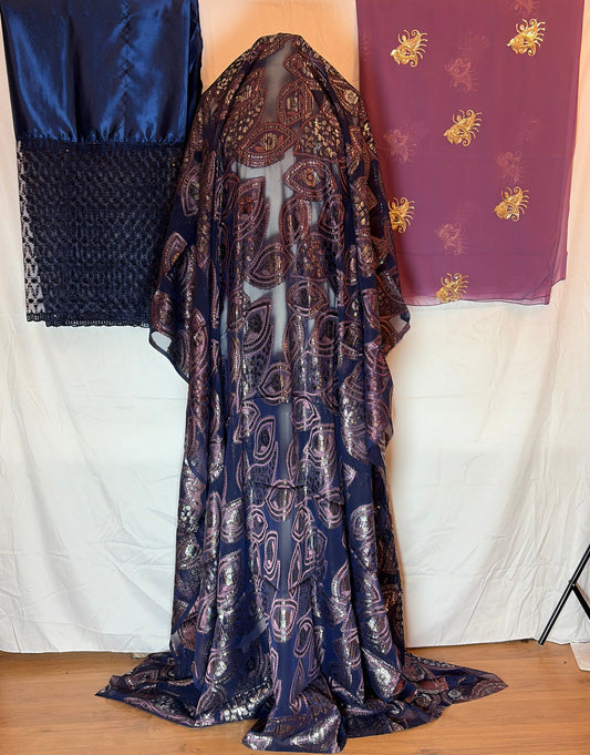 Patterned fabric on a bed with a wooden headboard