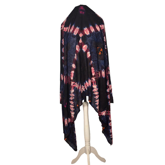 Tie-dye shirt hanging on a stand against a white backdrop