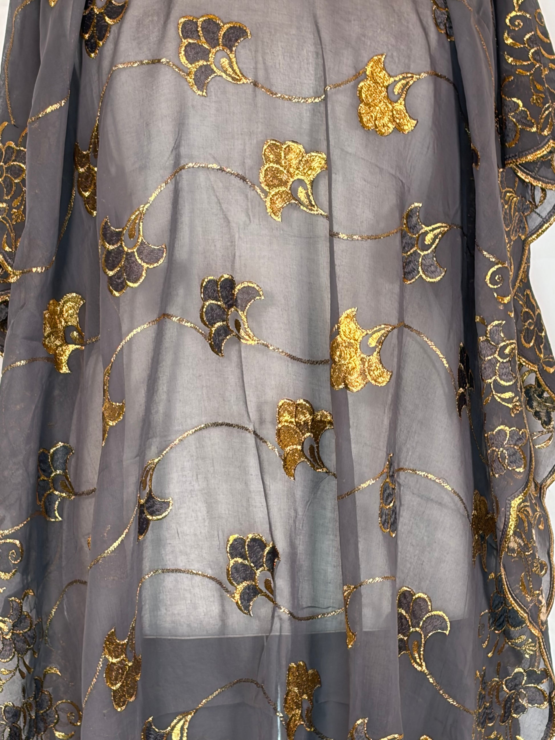 Black fabric with gold floral embroidery