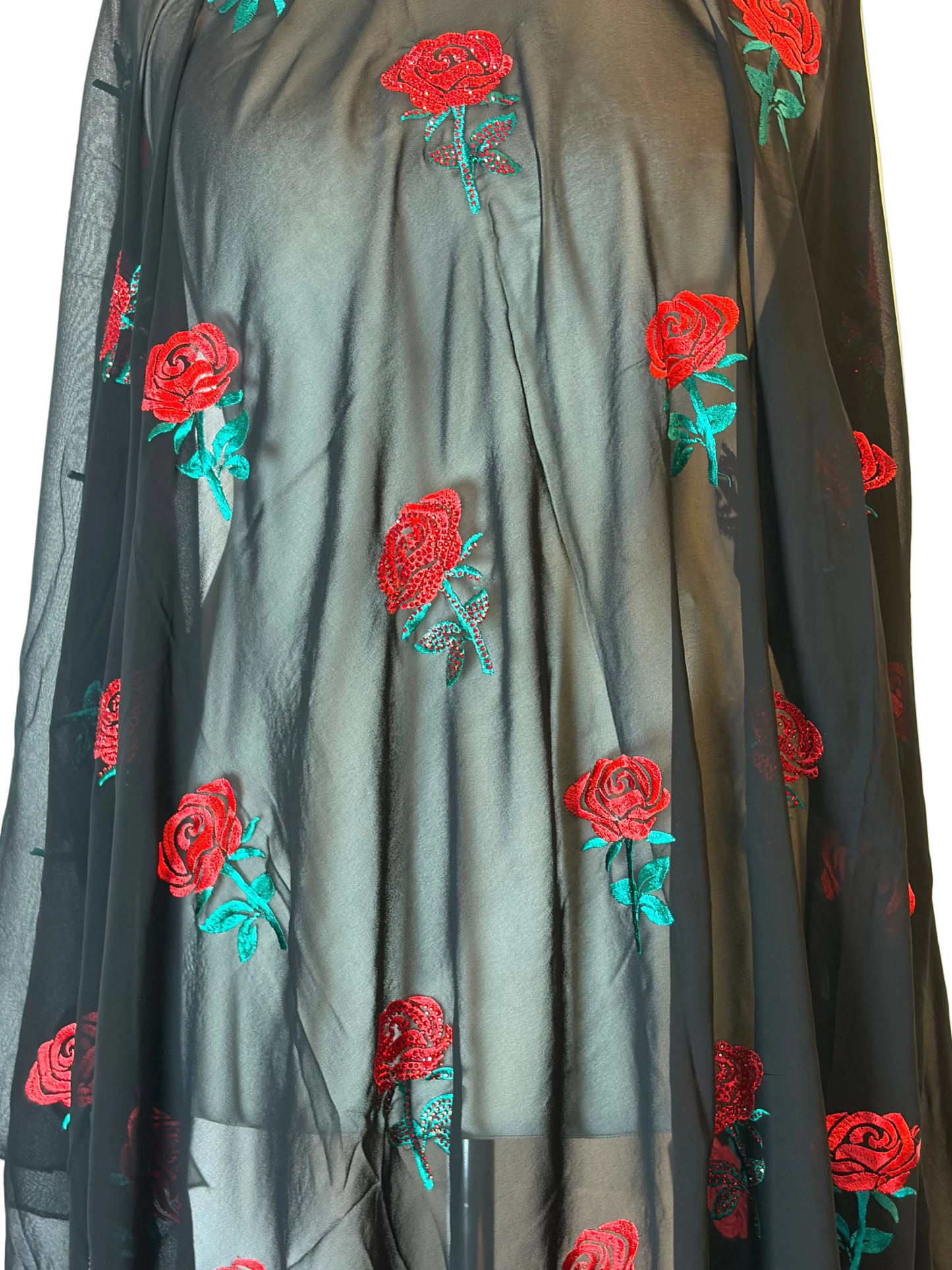 Dark fabric with red rose embroidery on a white background