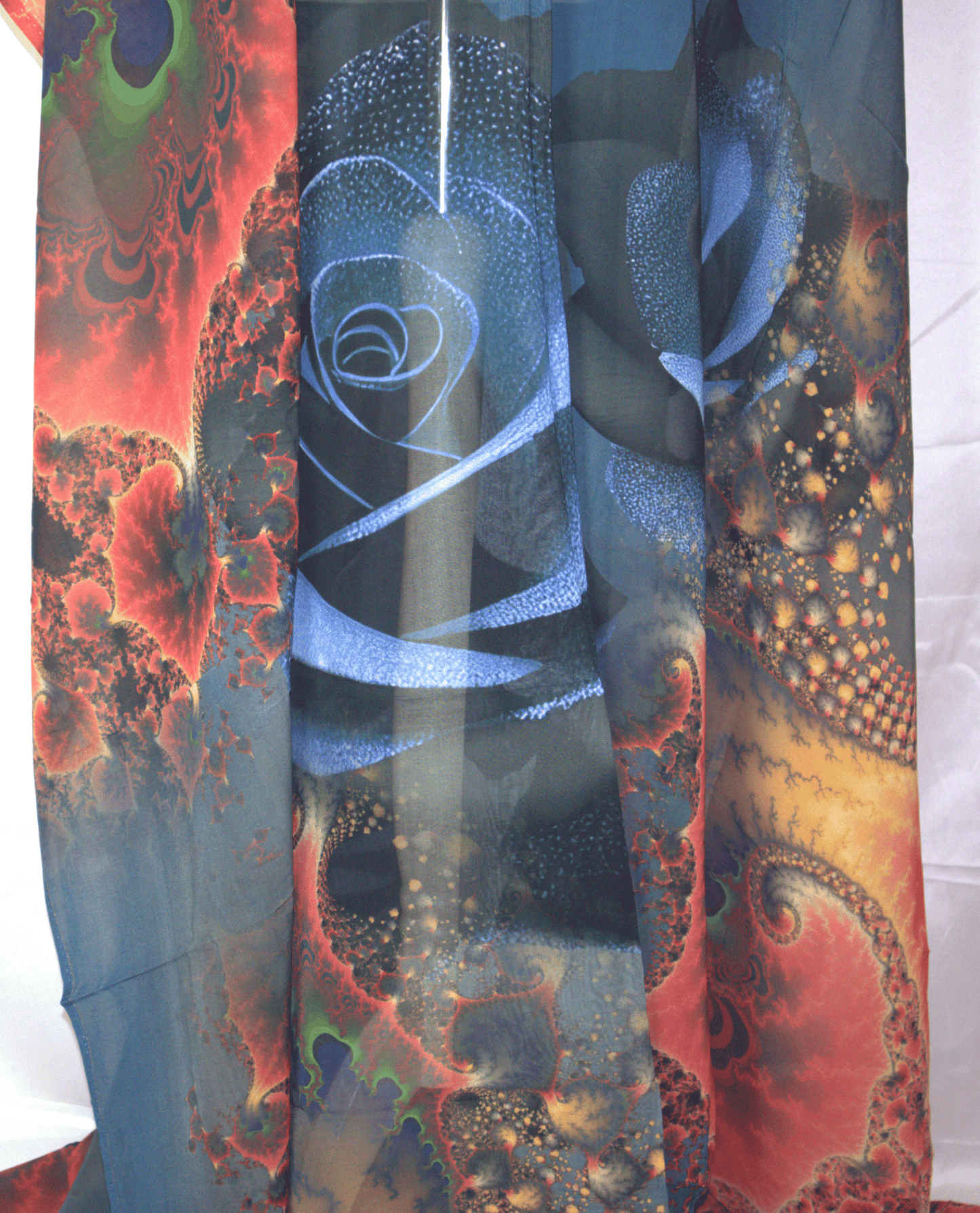 Colorful Dirac Fabric abstract patterned fabric with red, blue, and orange colors.