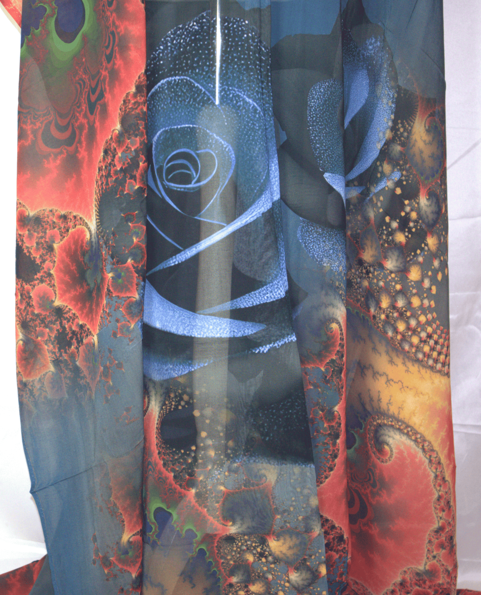Colorful Dirac Fabric abstract patterned fabric with red, blue, and orange colors.