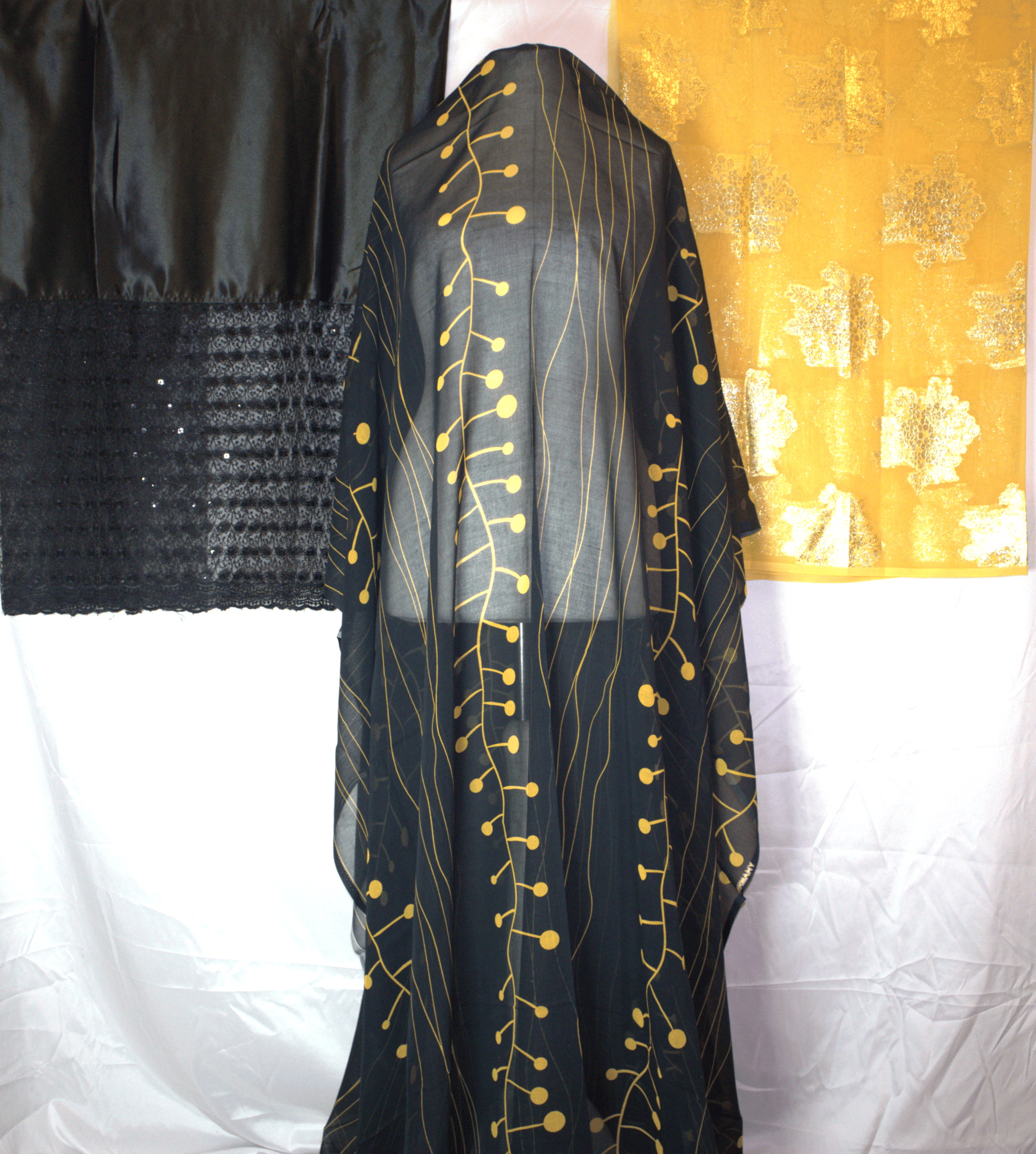 Black German Dirac garment with gold embroidery with Gold Gabsaar on a white background
