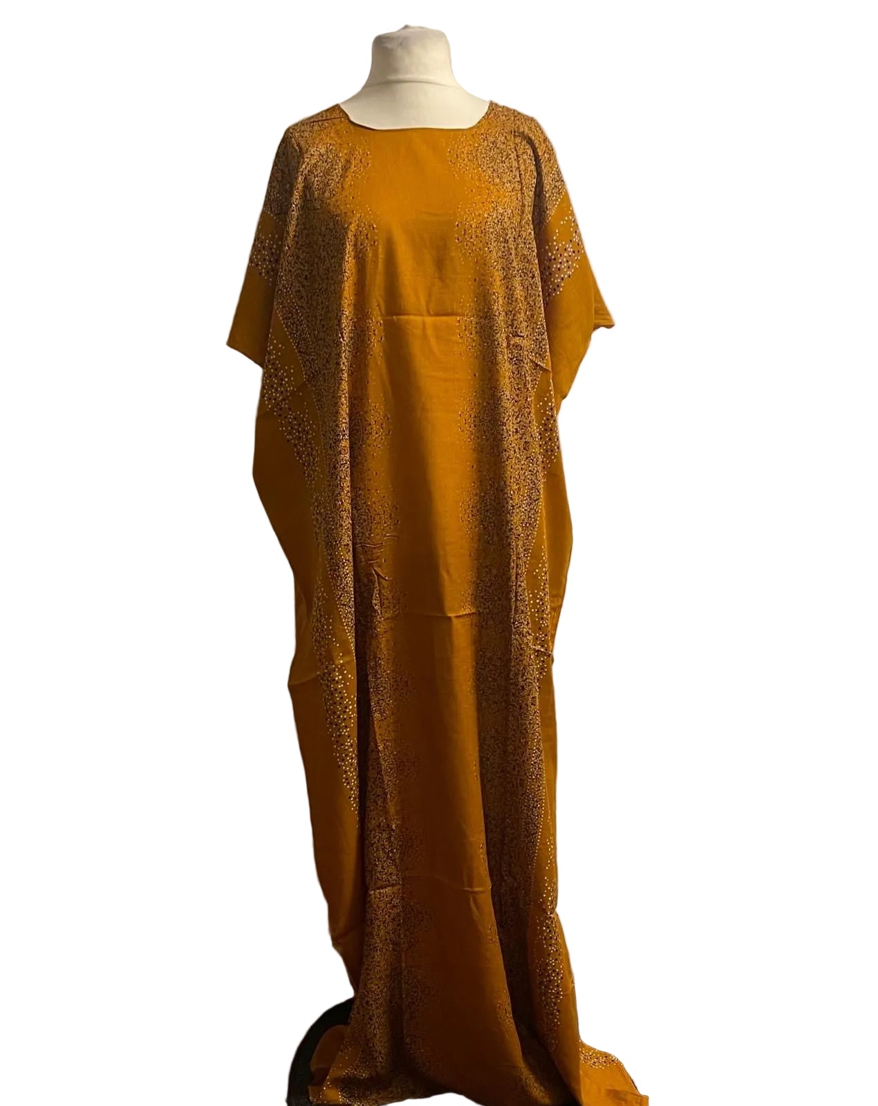 Mustard yellow Somali baati dress with intricate detailing on a mannequin against a white background