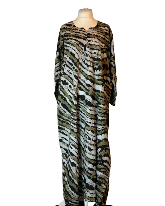 Zebra print dress on a mannequin against a plain background