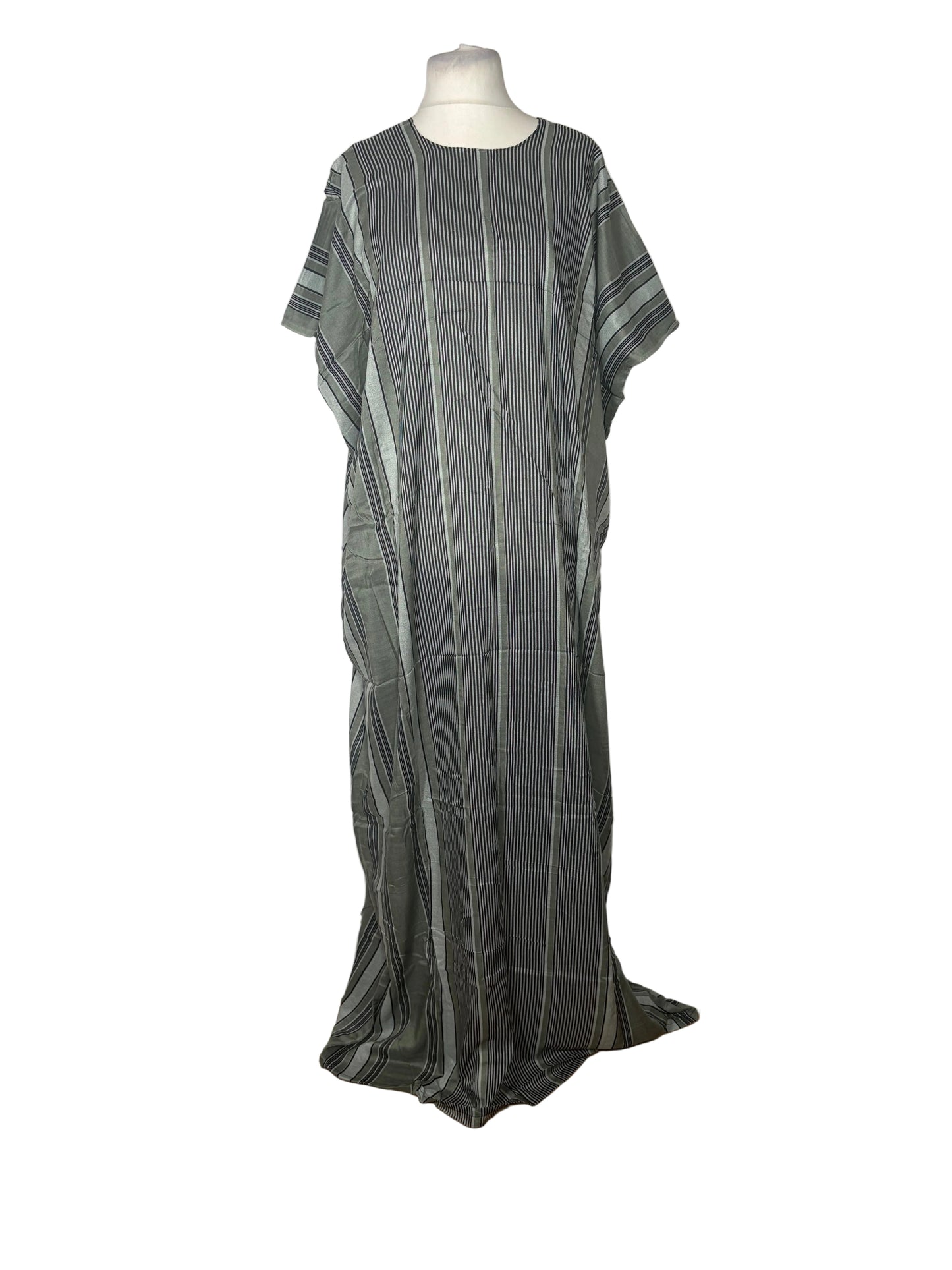 Green and gray striped dress on a mannequin against a white backdrop