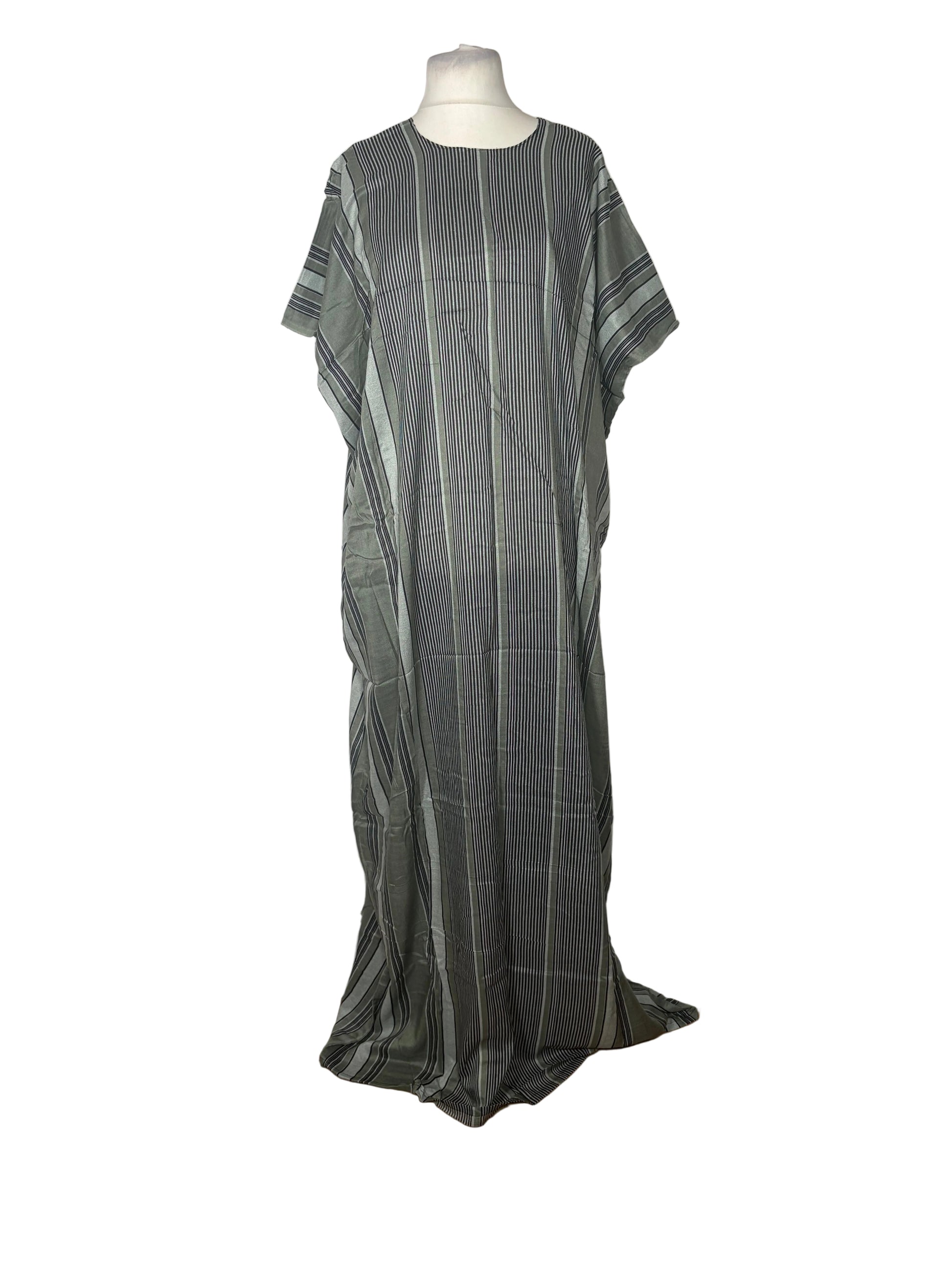 Green and gray striped dress on a mannequin against a white backdrop
