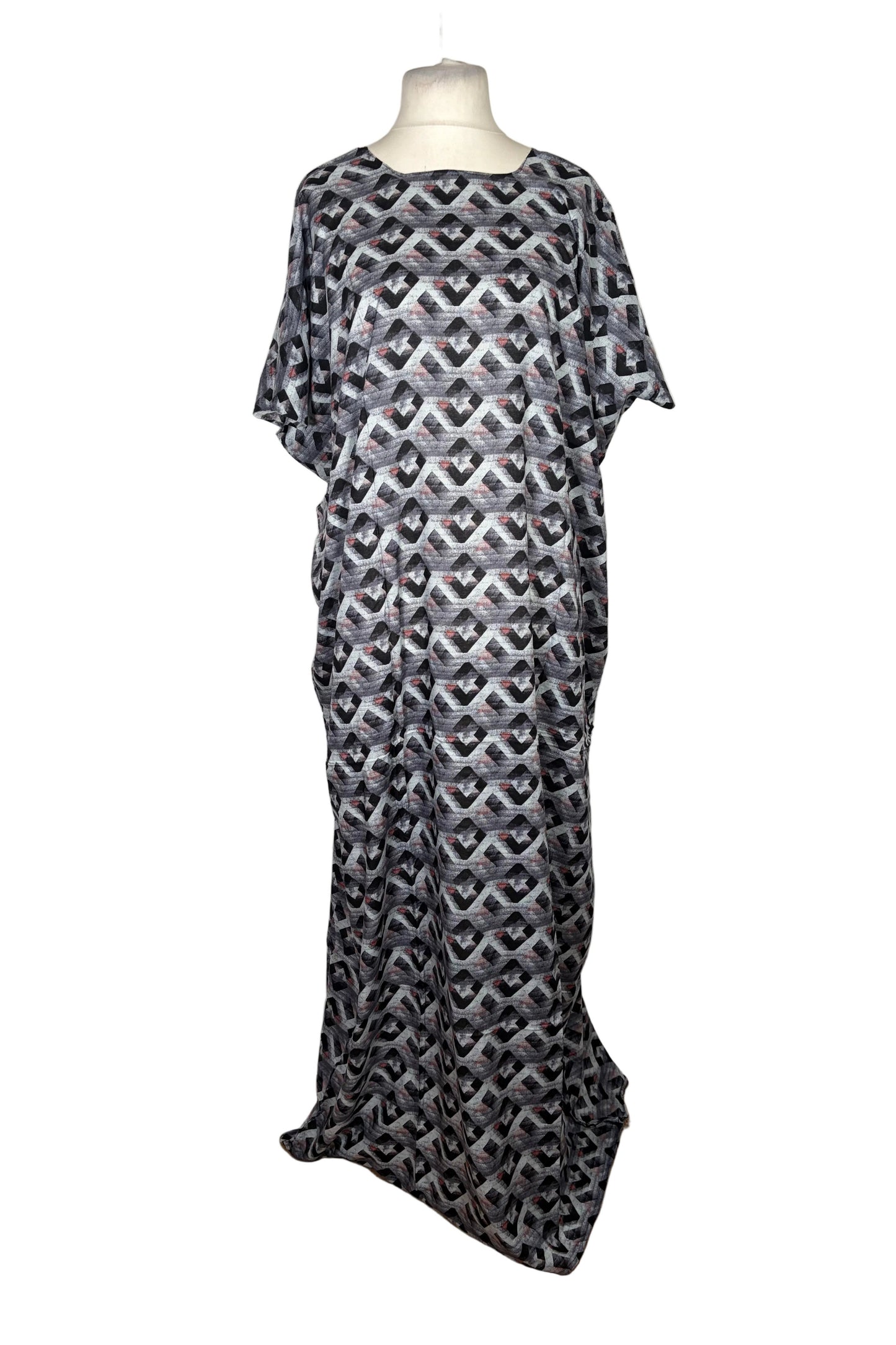 Black and white patterned Baati dress on a mannequin against a white background