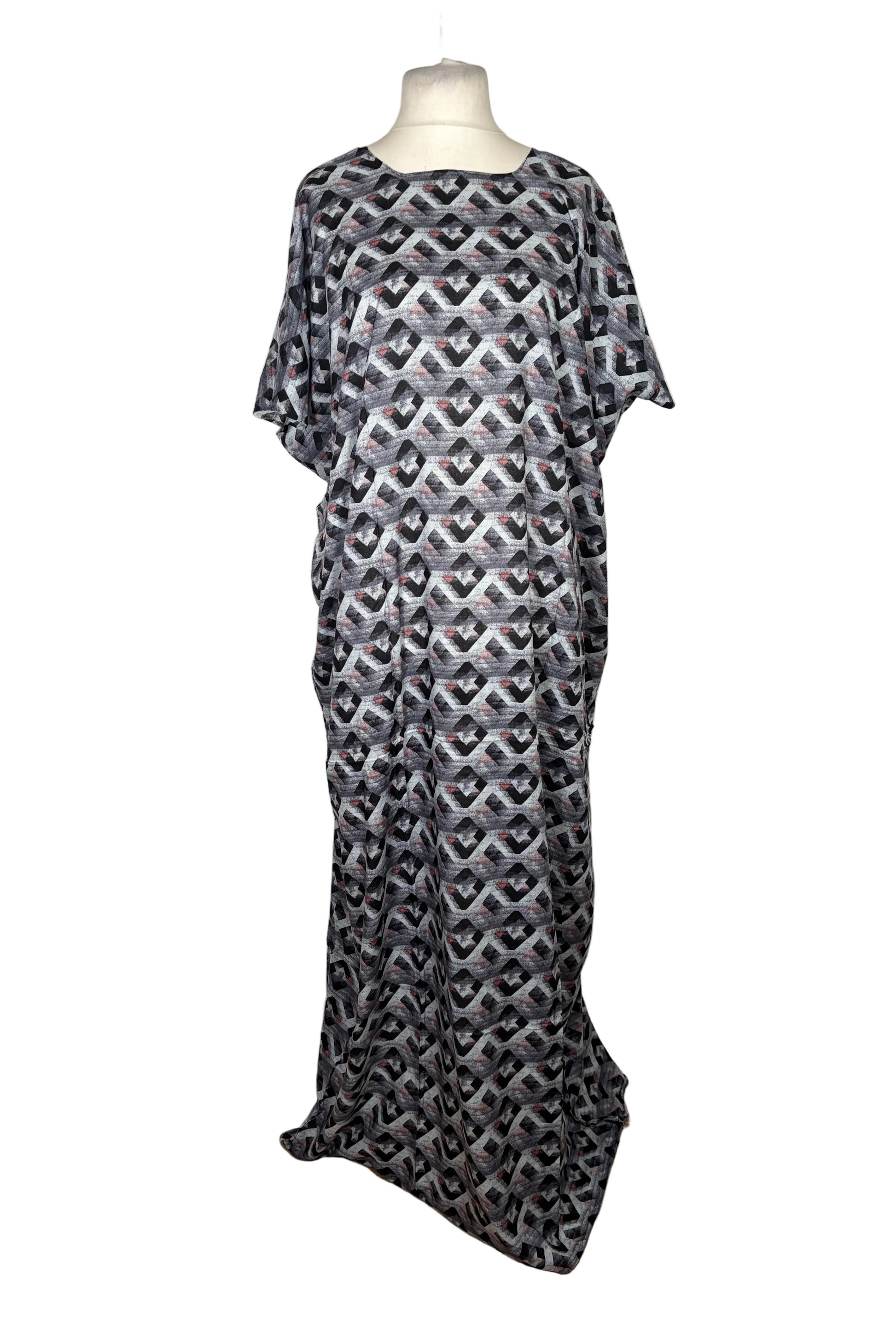 Black and white patterned Baati dress on a mannequin against a white background