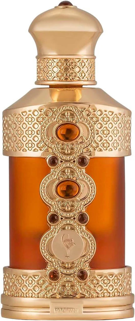 Decorative perfume bottle with intricate gold design and amber liquid