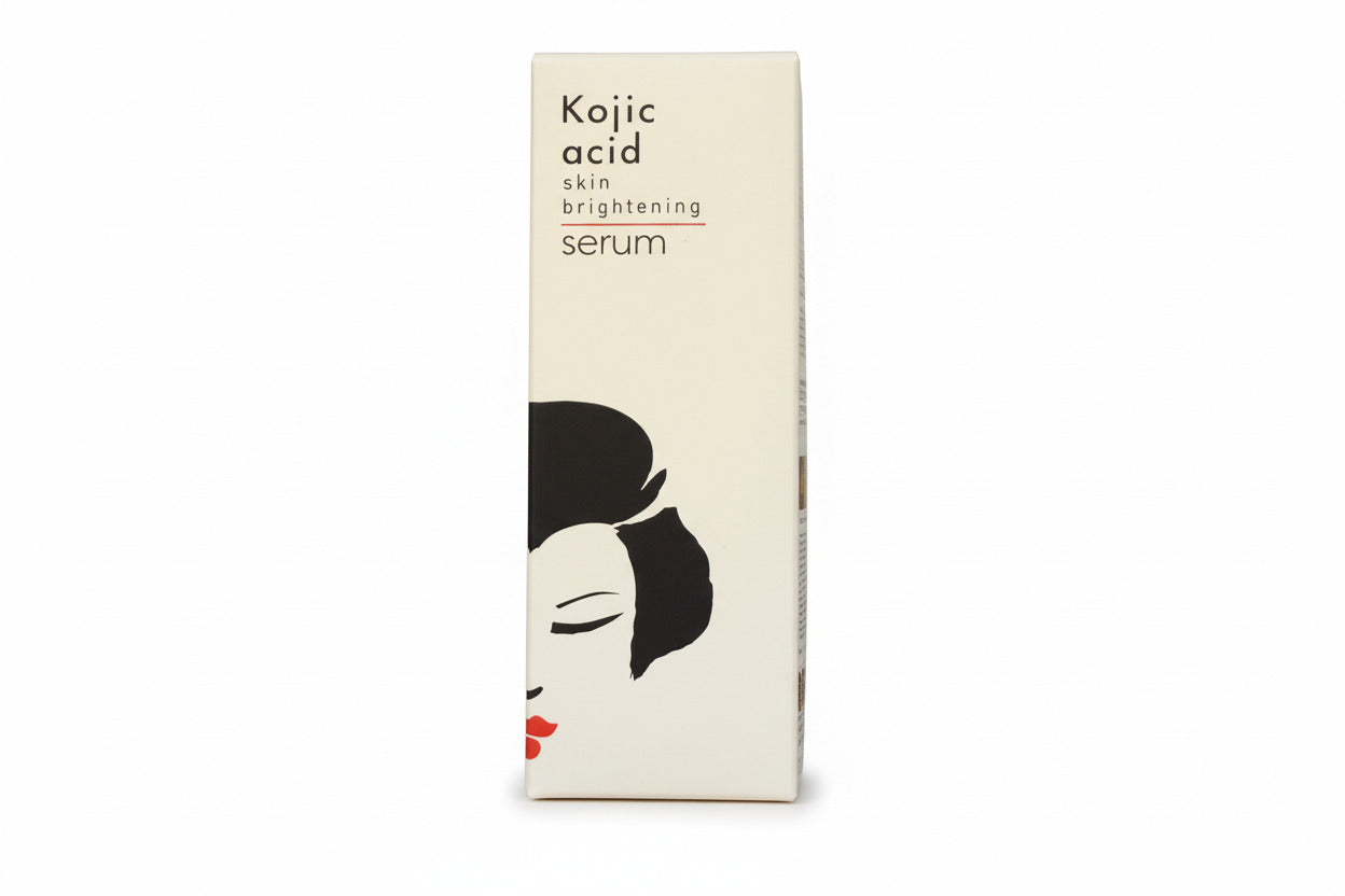 Kojic acid skin brightening serum packaging on a decorative background
