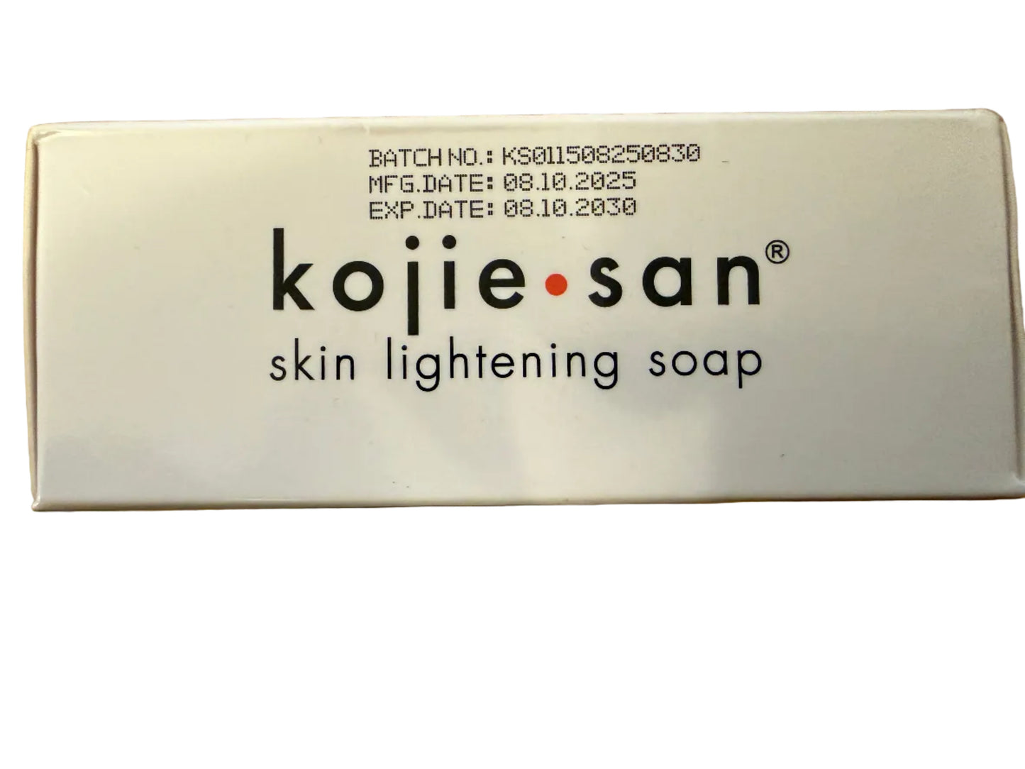 Kojie San skin lightening soap packaging on a cardboard background