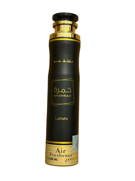 A tall cylindrical bottle of Khamrah Lattafa Air Freshener, featuring a black body with gold accents, a gold cap, and gold lettering on a white background.