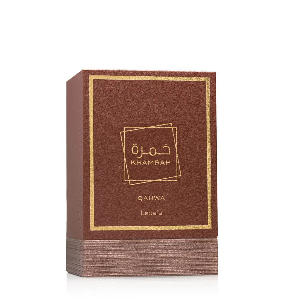A stack of brown rectangular boxes with gold borders and gold text reading 'KHAMRAH' and 'OAHWA Lattafa' on a clean white background.