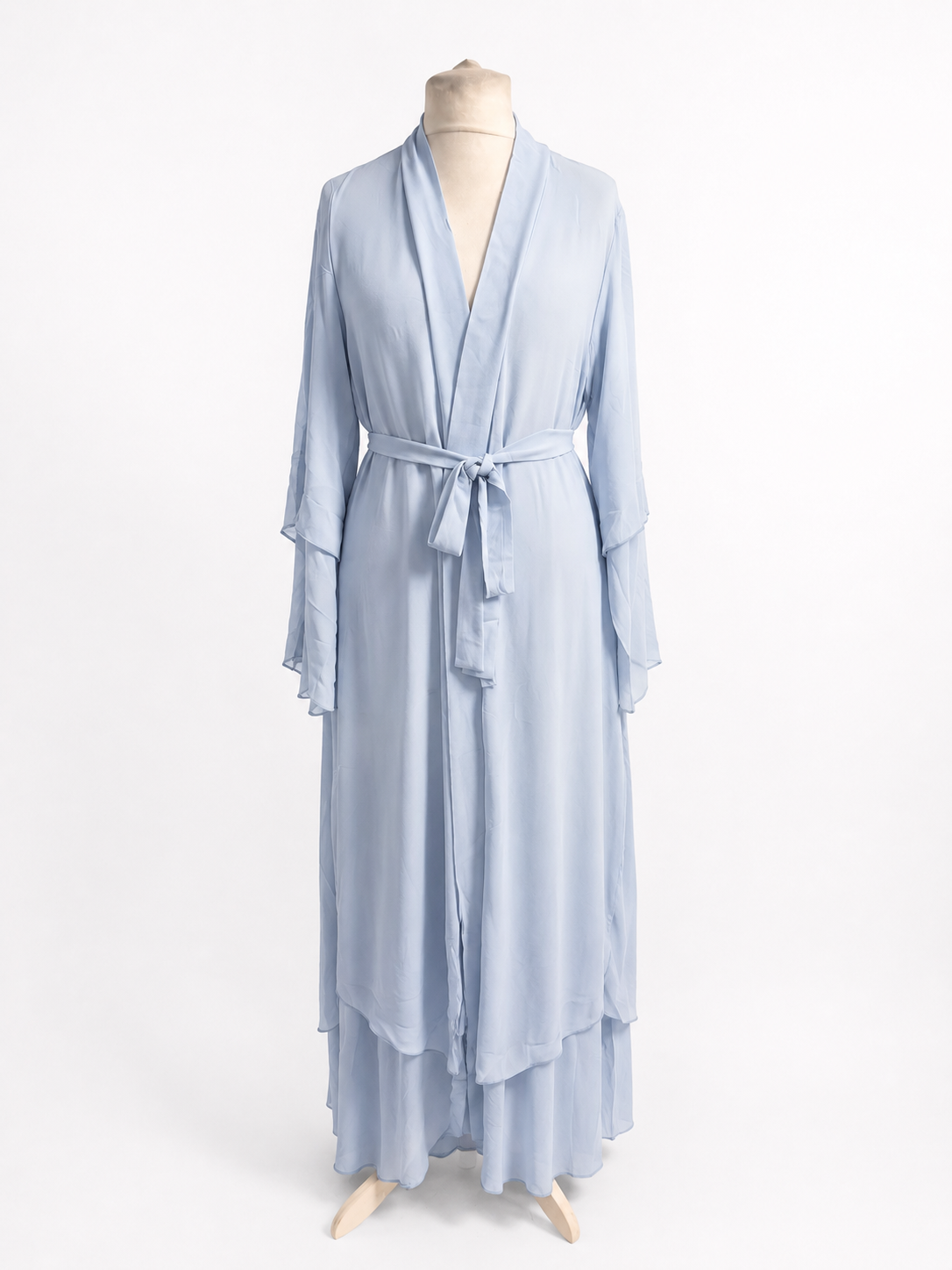 Light blue abaya on a mannequin against a white background