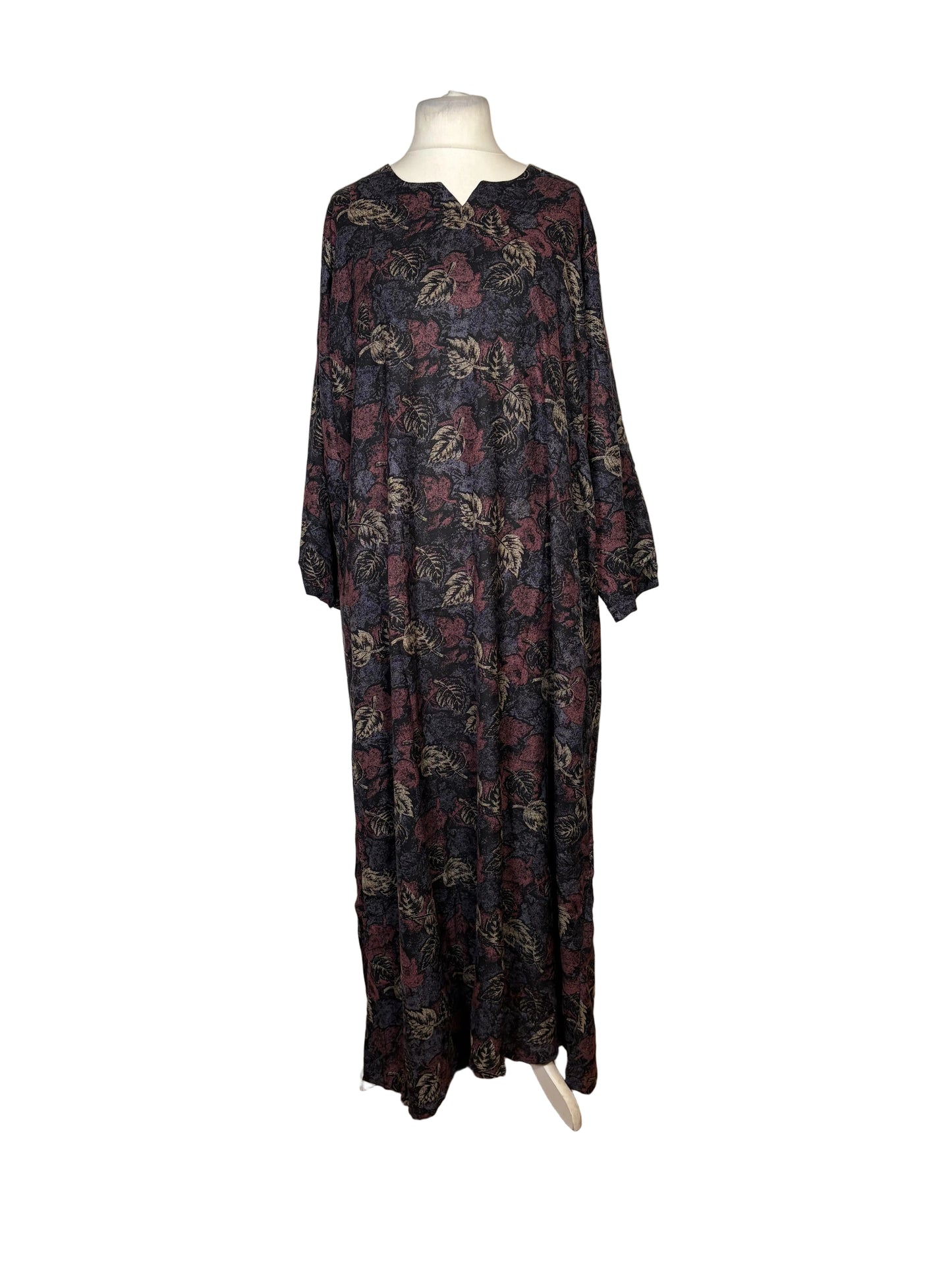 Long floral dress on a mannequin against a white backdrop