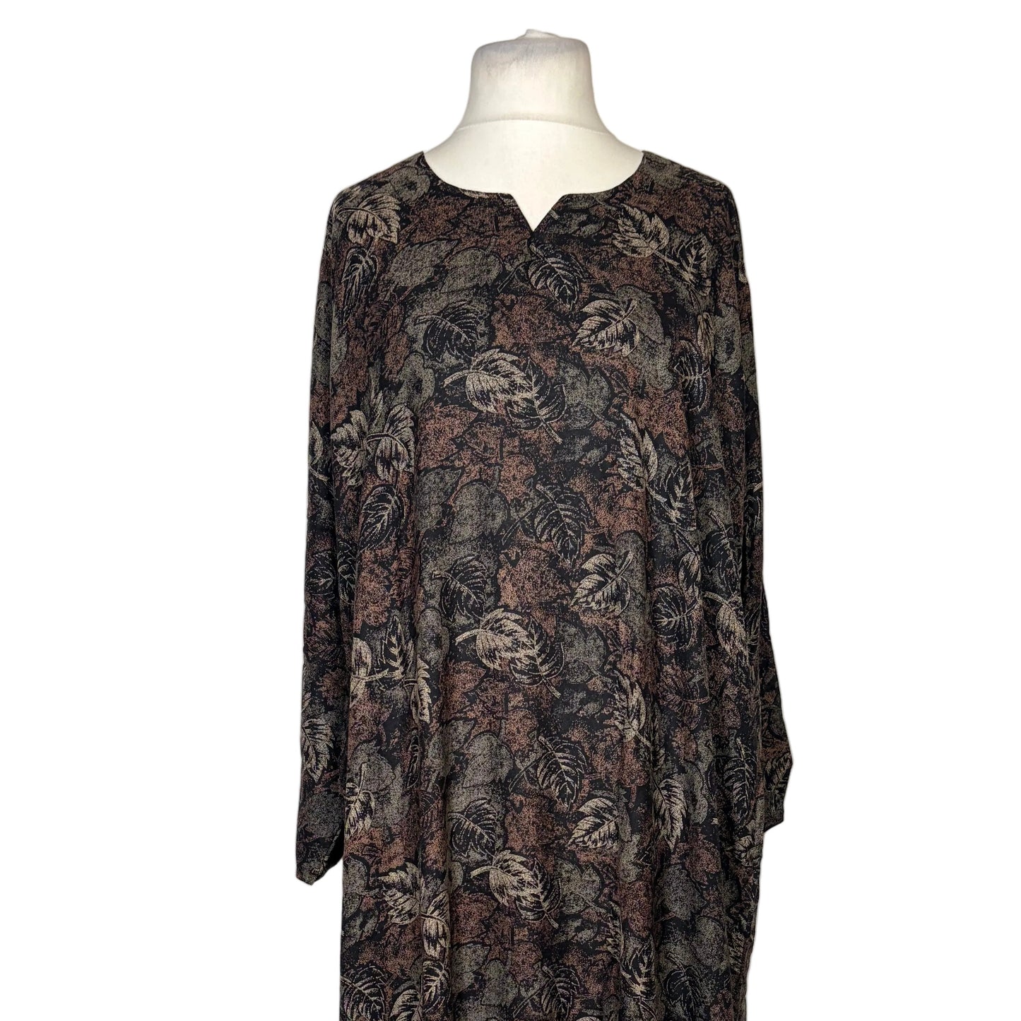 Long floral dress on a mannequin against a white backdrop