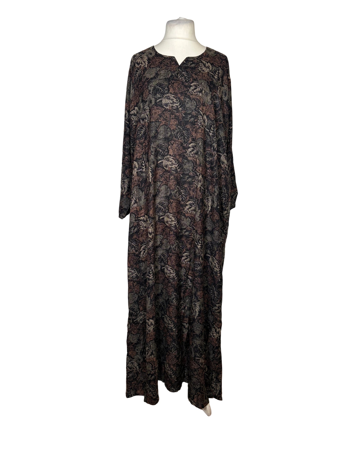 Long floral dress on a mannequin against a white backdrop