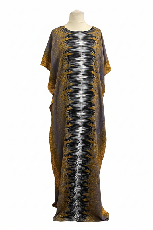 Long Somali baati dress with a pattern on a mannequin against a white background