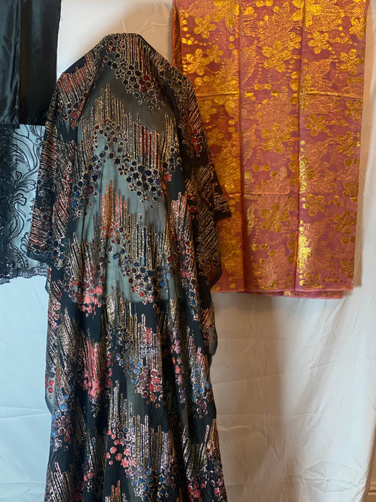 Maqbal Dirac fabric with intricate patterns on a white surface