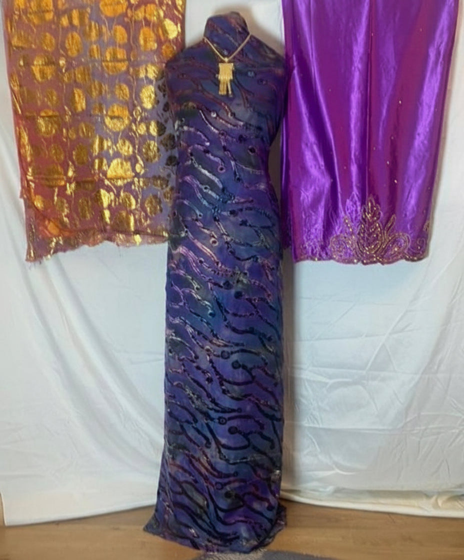 Purple Somali Dirac Fabric with gold patterns on a white background