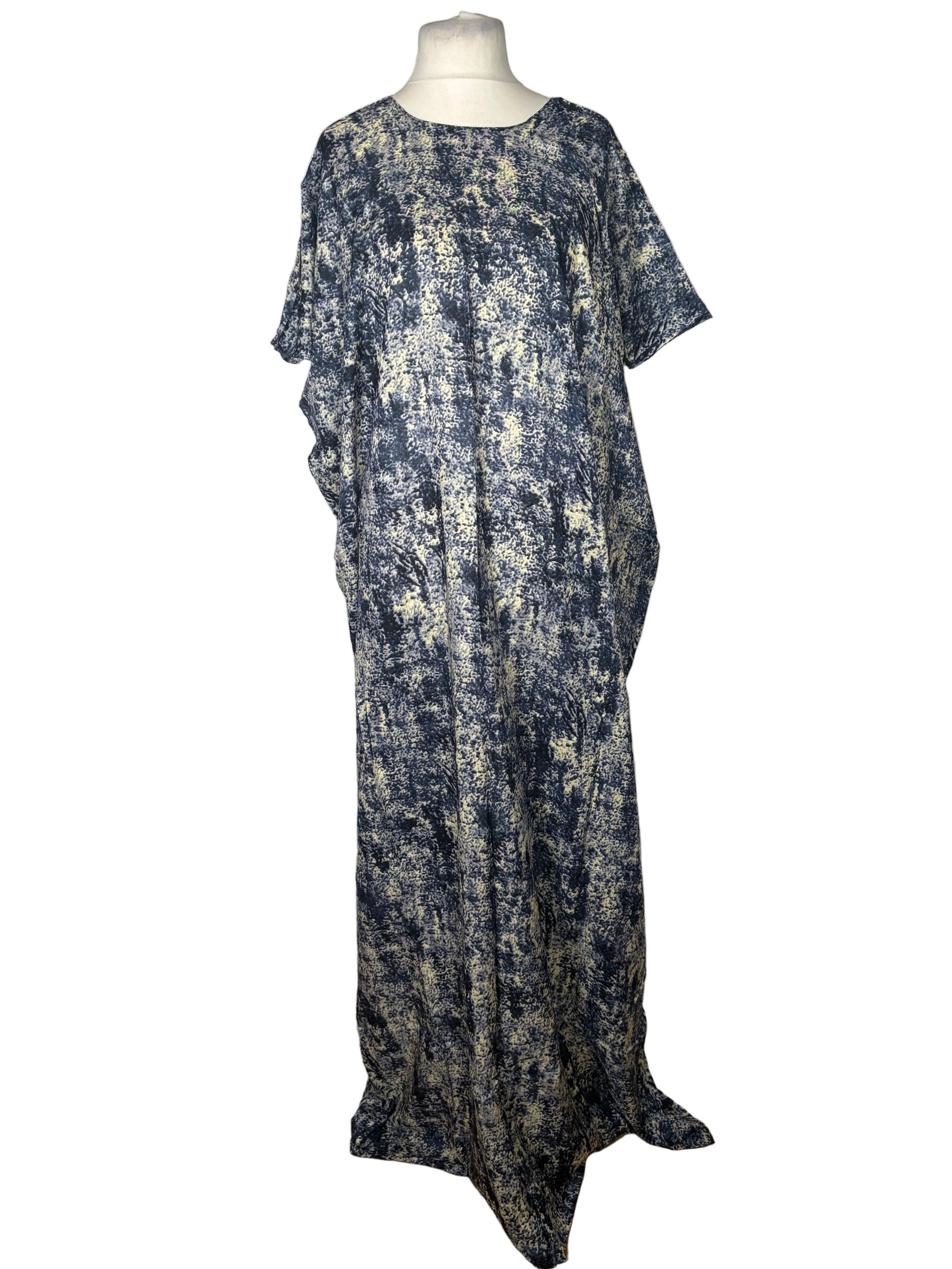Long, patterned Somali Baati on a mannequin against a white background