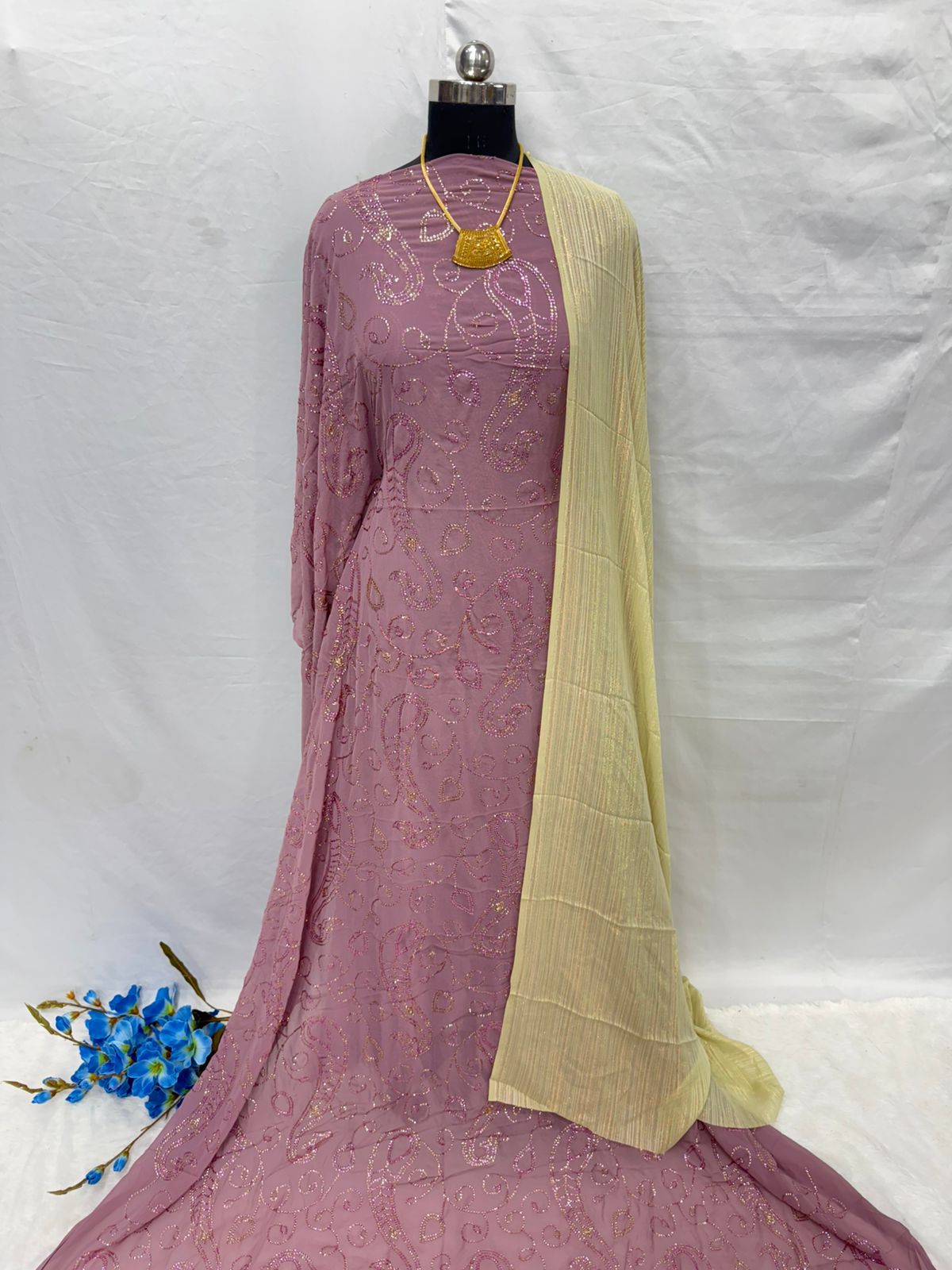 Mauve embroidered Maysa Dirac with a yellow blouse on a mannequin against a white background