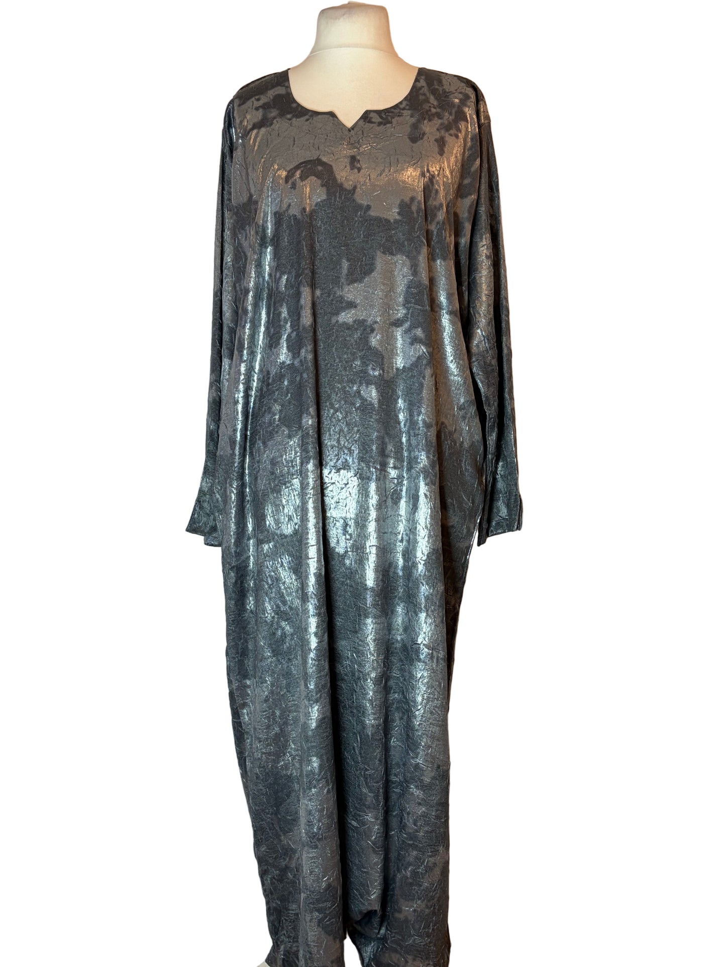 Metallic silver dress on a mannequin against a white background