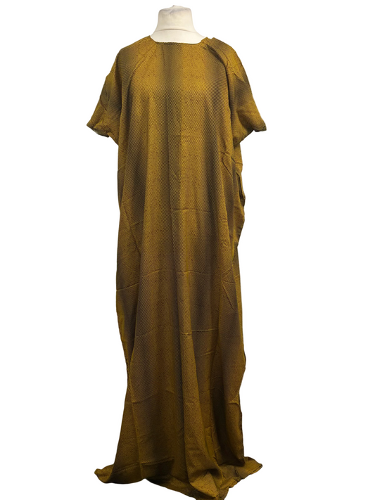 Long mustard yellow dress on a mannequin against a white background