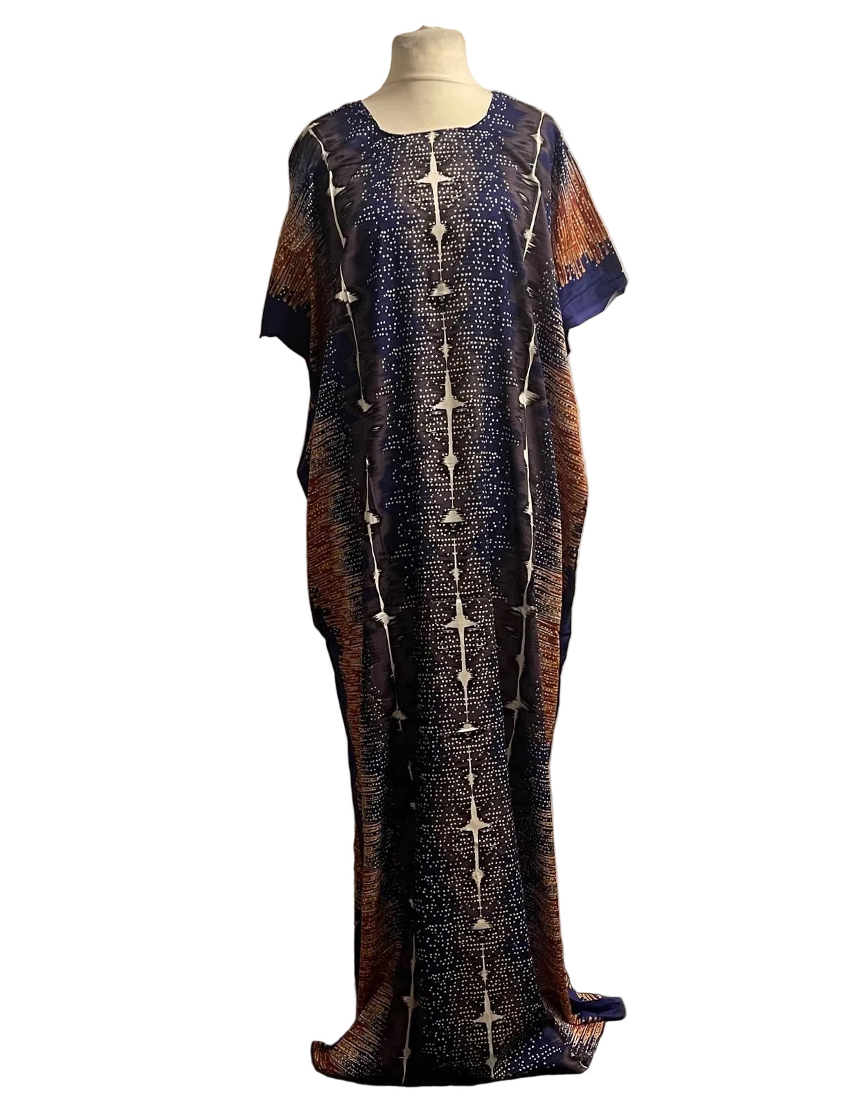 Long, patterned navy somali baati dress on a mannequin against a plain white background