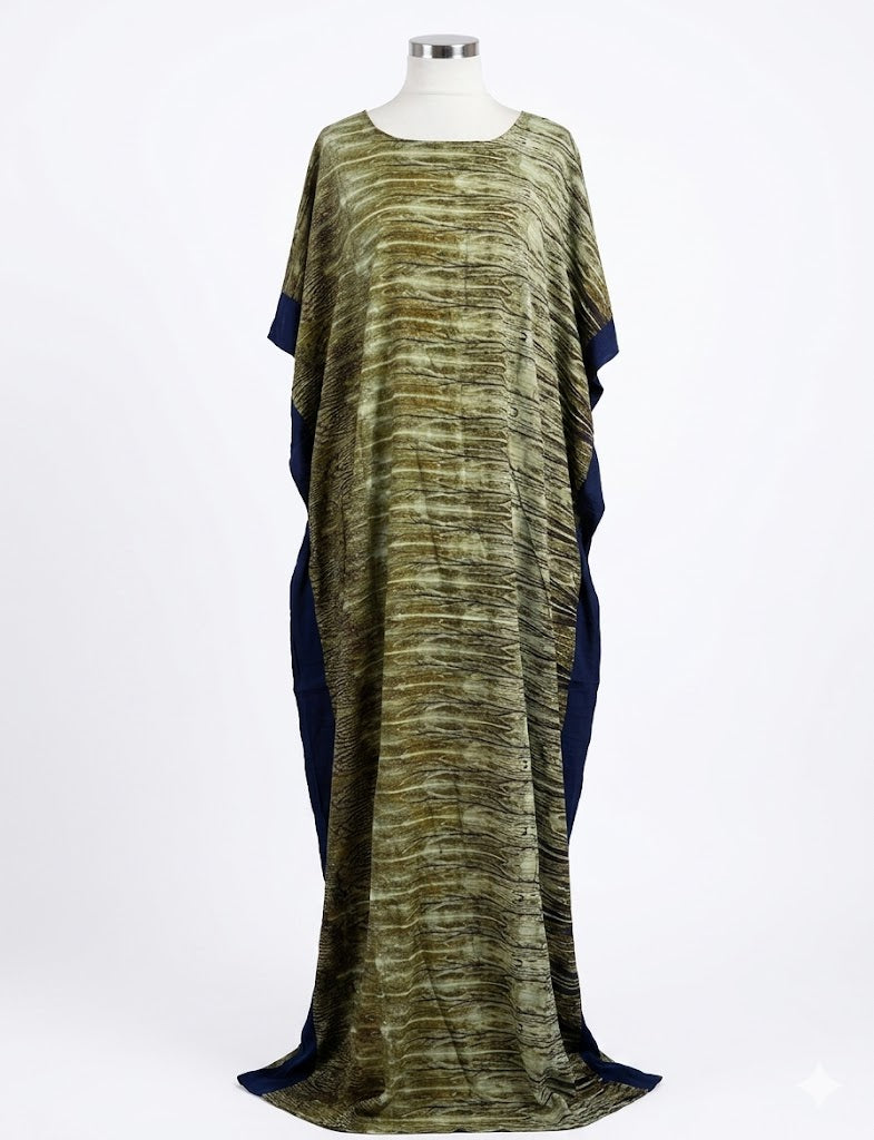 Long, flowing Somali baati dress with a pattern on a mannequin against a white background