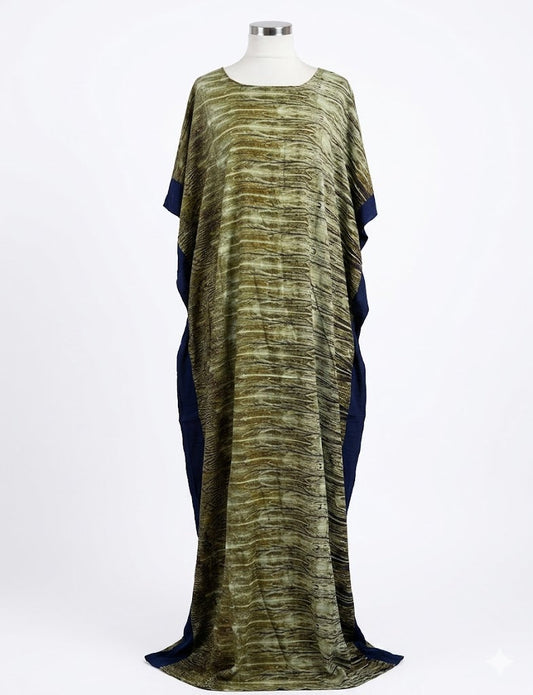 Long, flowing Somali baati dress with a pattern on a mannequin against a white background