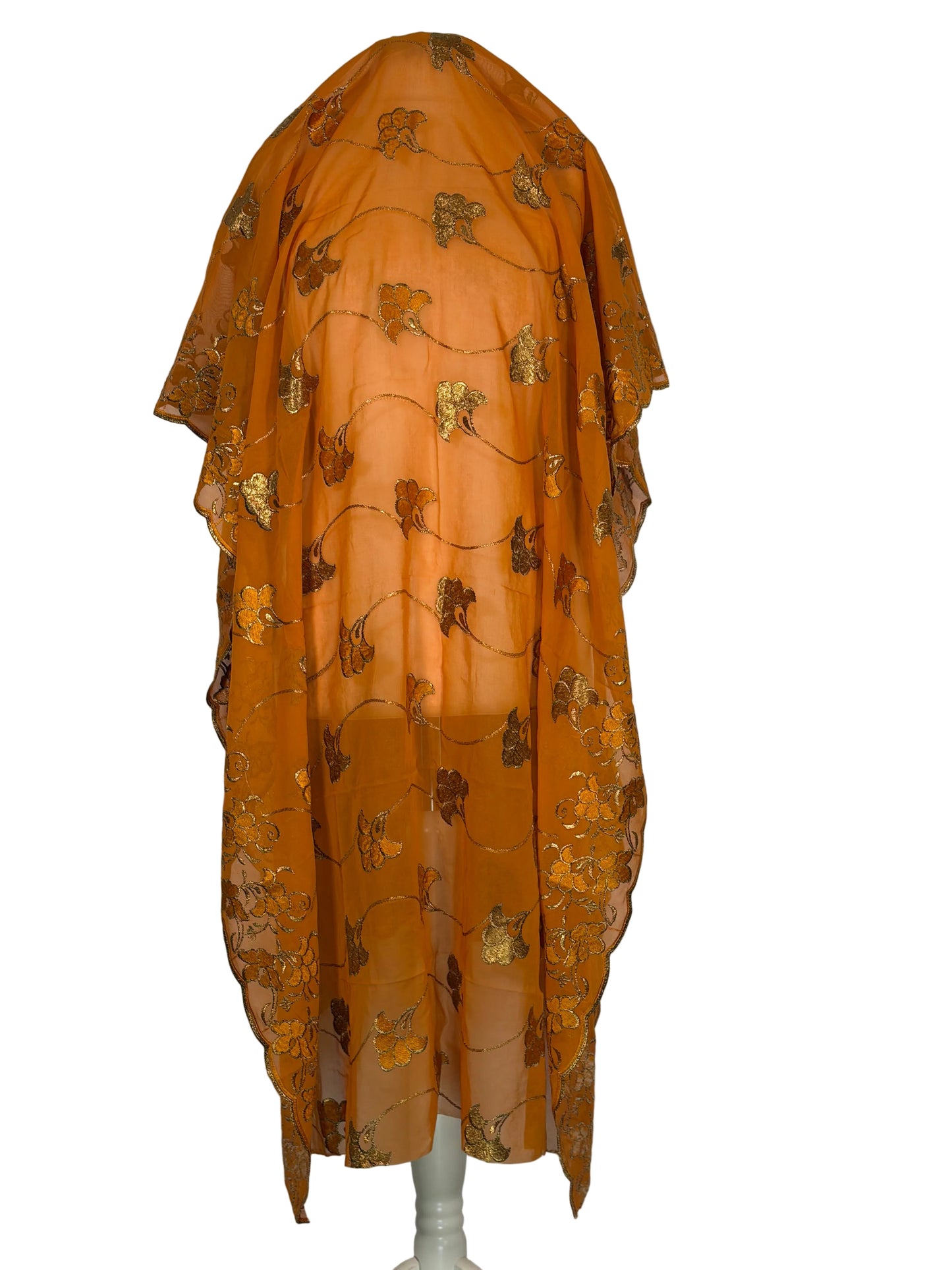 Orange fabric with gold floral patterns on a white background