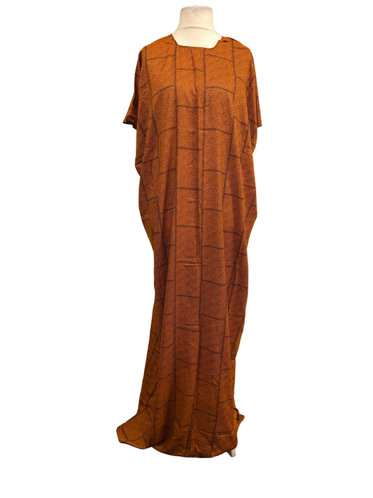 Brown checkered dress on a mannequin against a white backdrop