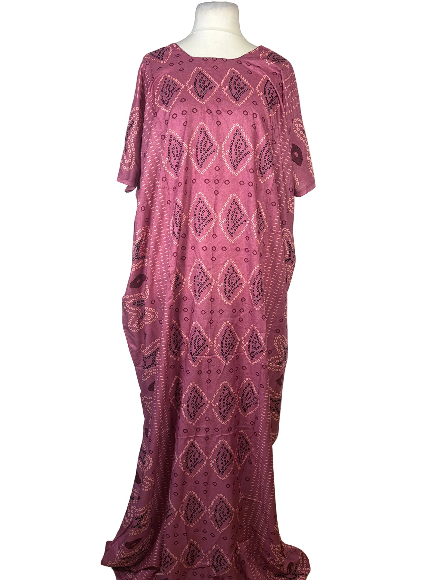 Purple patterned Somali baati on a mannequin against a white background