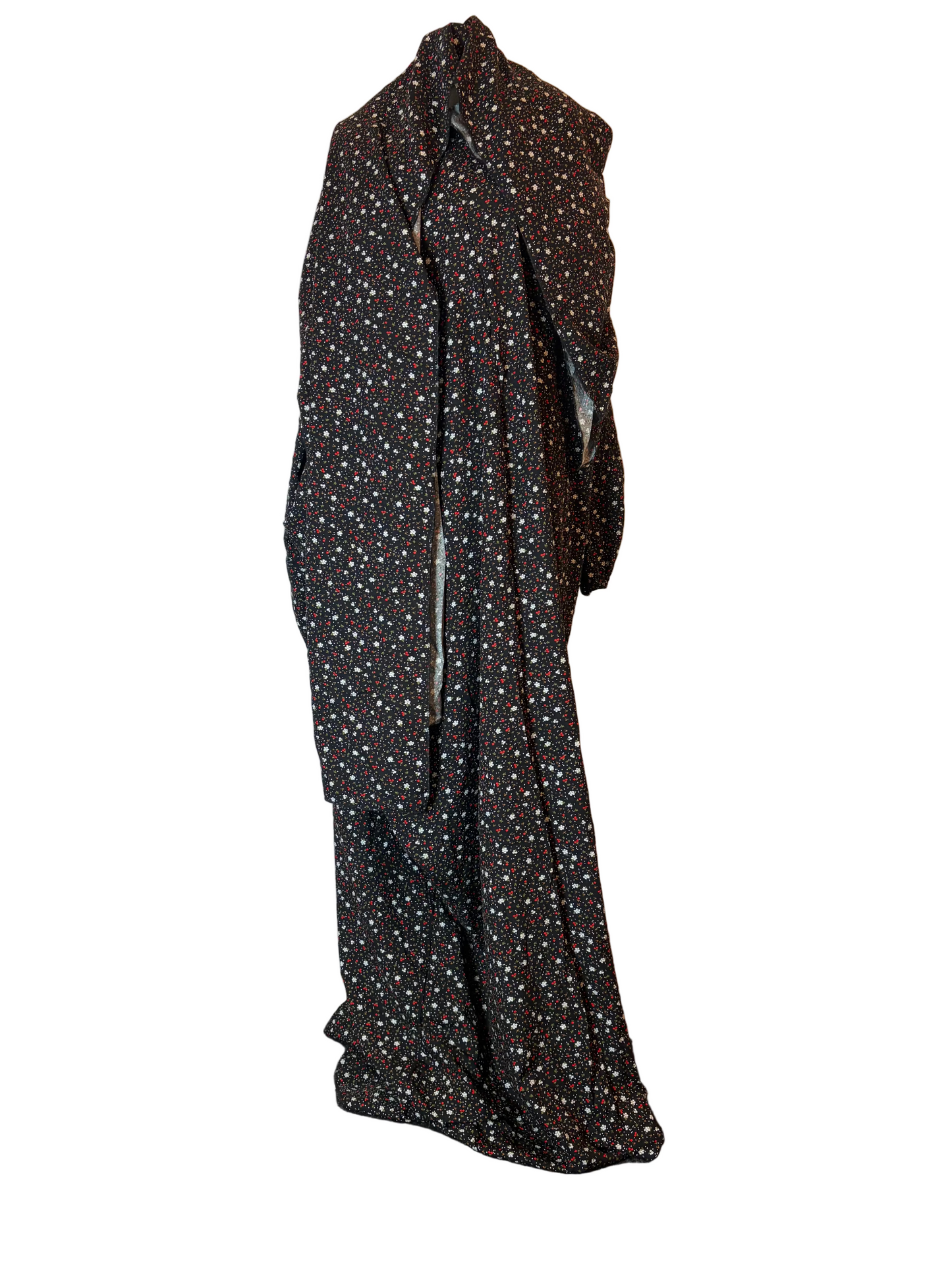 Black dress with white polka dot pattern on a white background