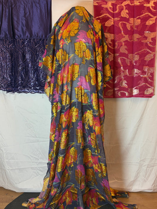 Colorful Somali Dirac fabric with floral patterns on a white surface