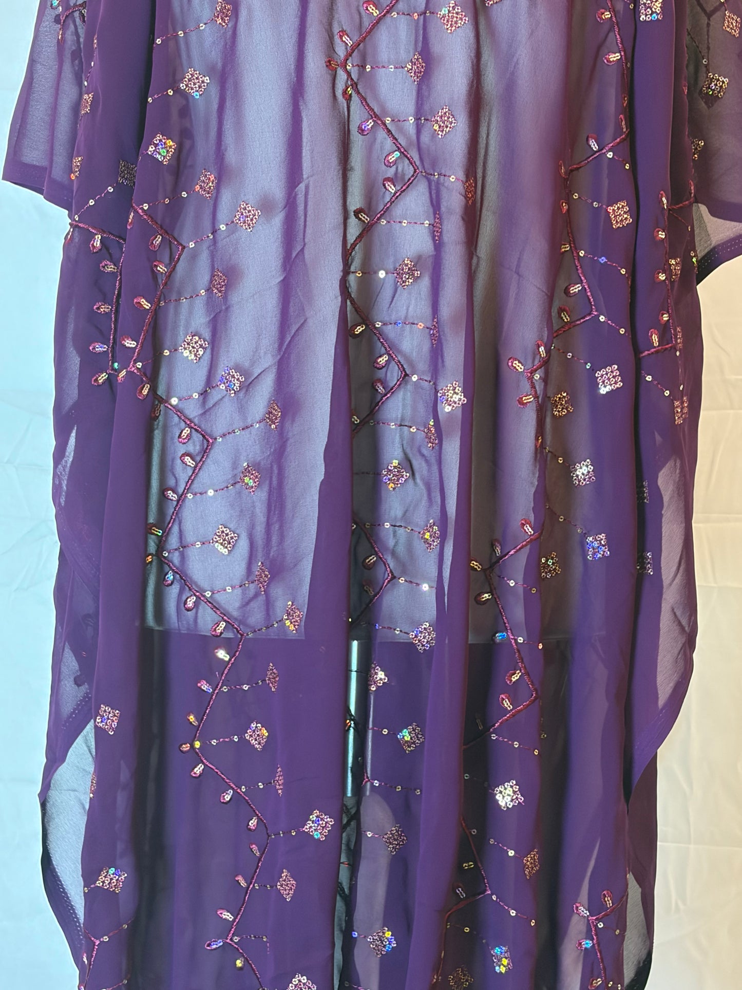 Purple Garbasaar fabric with intricate gold embroidery on a white background