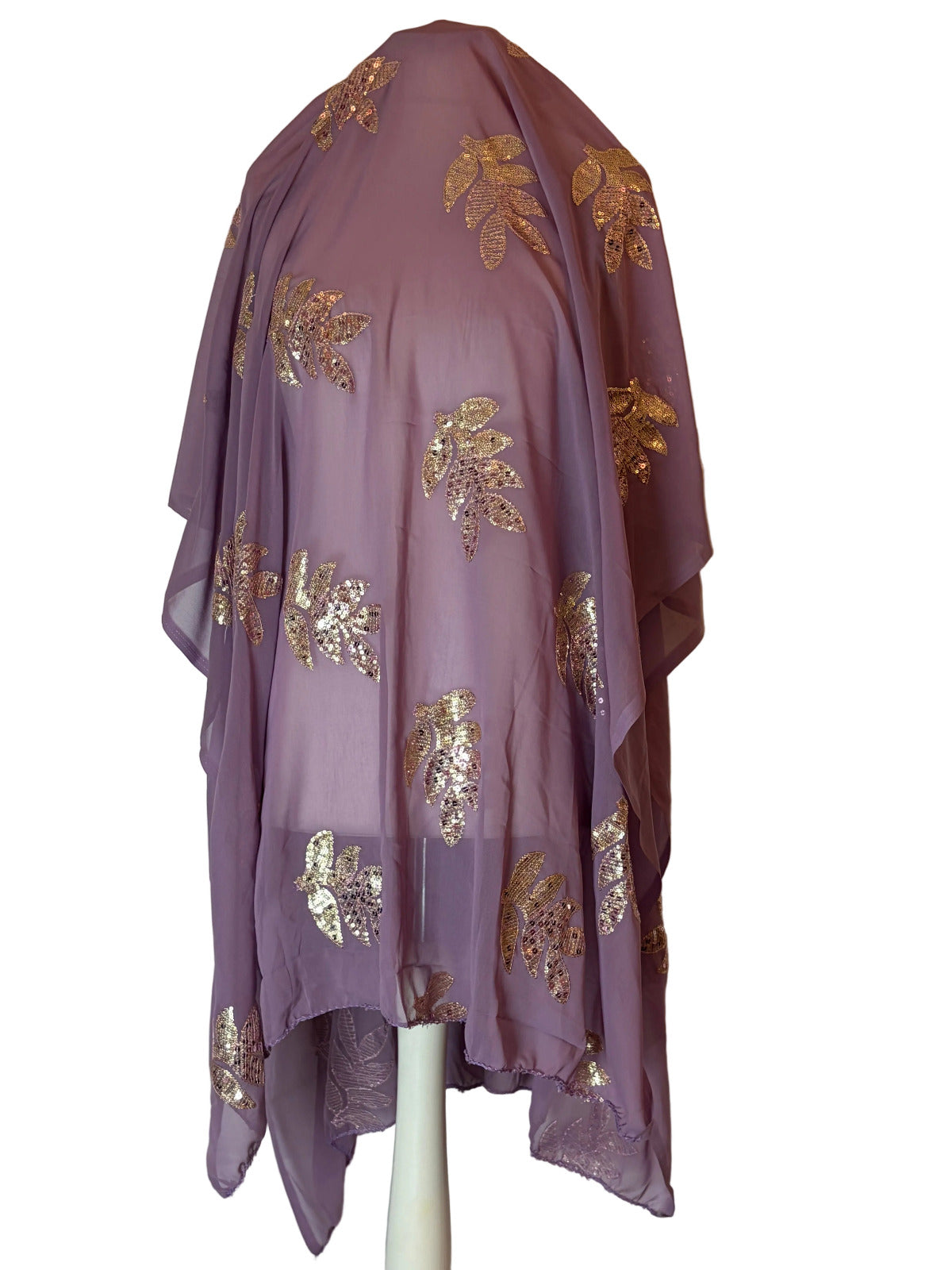 Purple Somali Garbasaar fabric with gold embroidery on a white surface