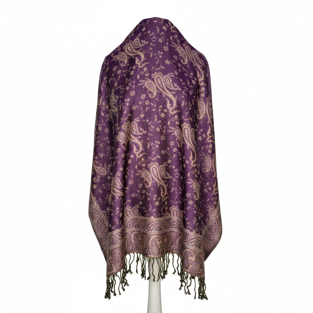 Purple scarf with paisley pattern draped over a mannquin