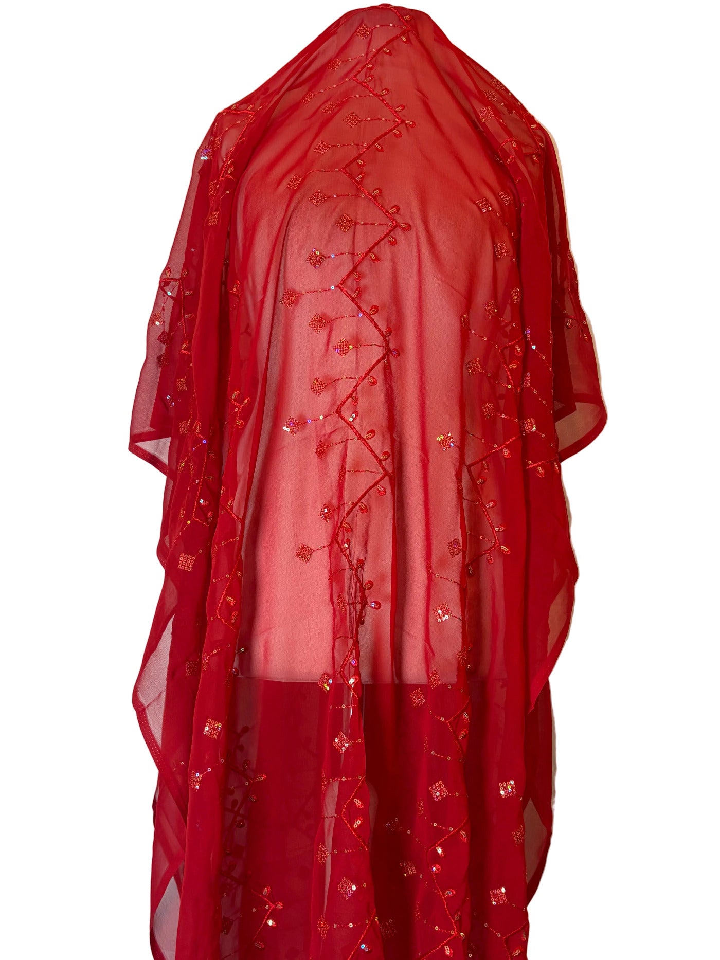 Red fabric with decorative patterns on a white background