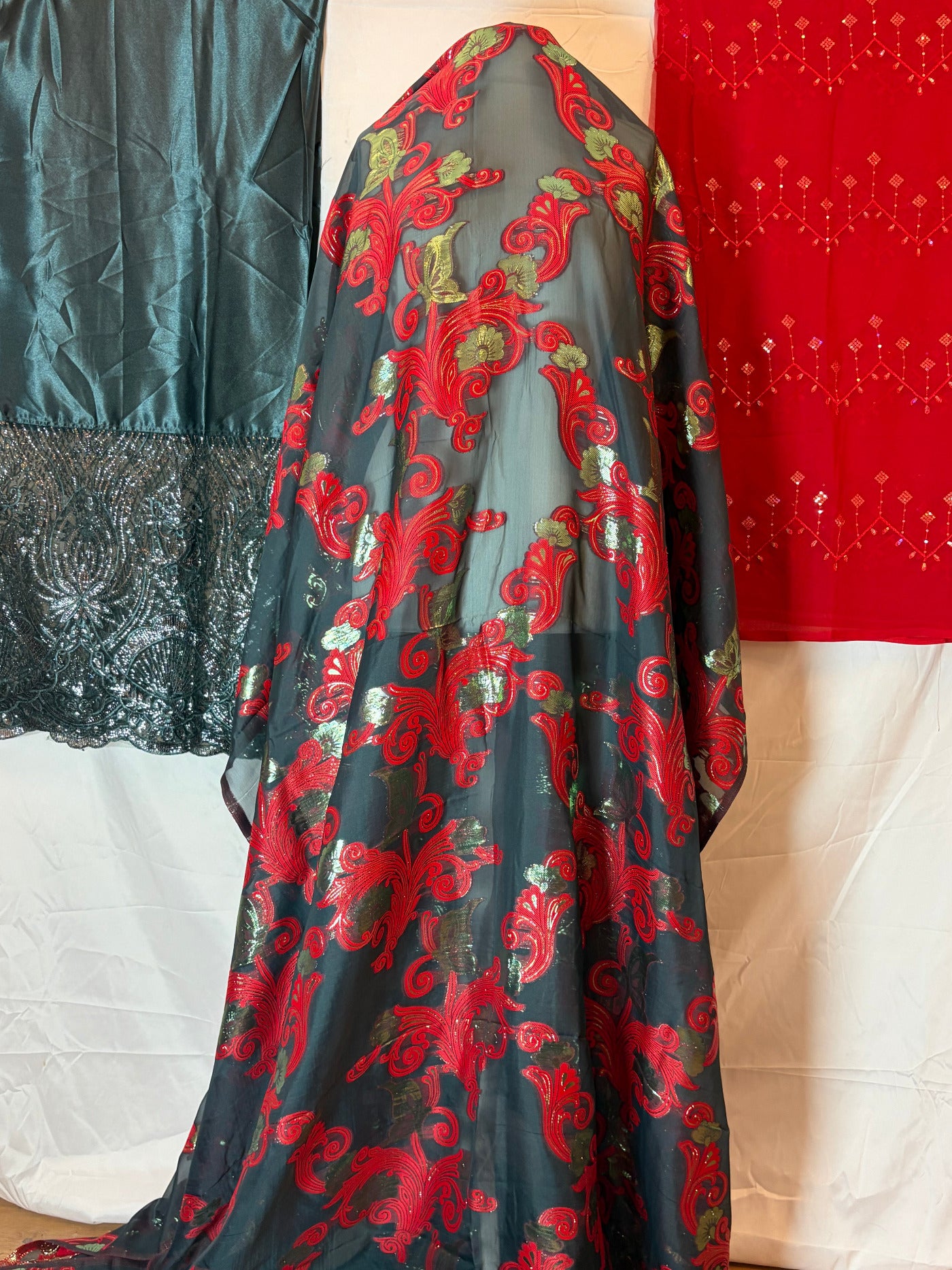 Somali fransawi Dirac fabric with red and black pattern on a white surface