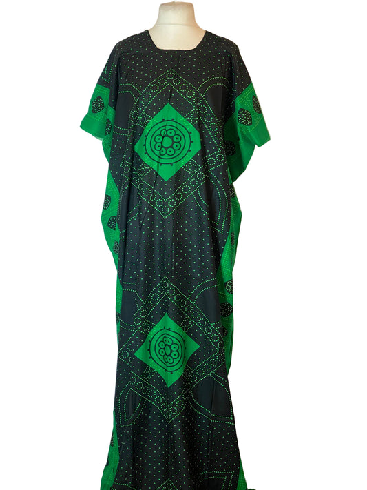 Green and black patterned Somali Baati on a mannequin against a white background