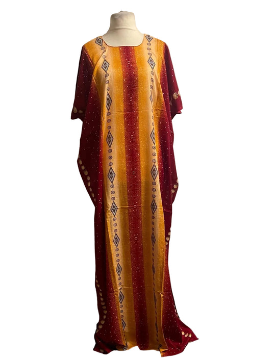 Long Somali baati with red and yellow pattern on a mannequin against a white background