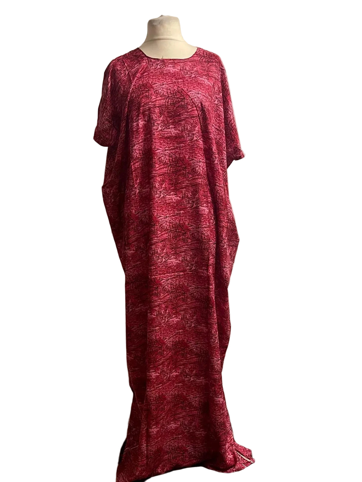 Red Somali baati dress on a mannequin against a white background