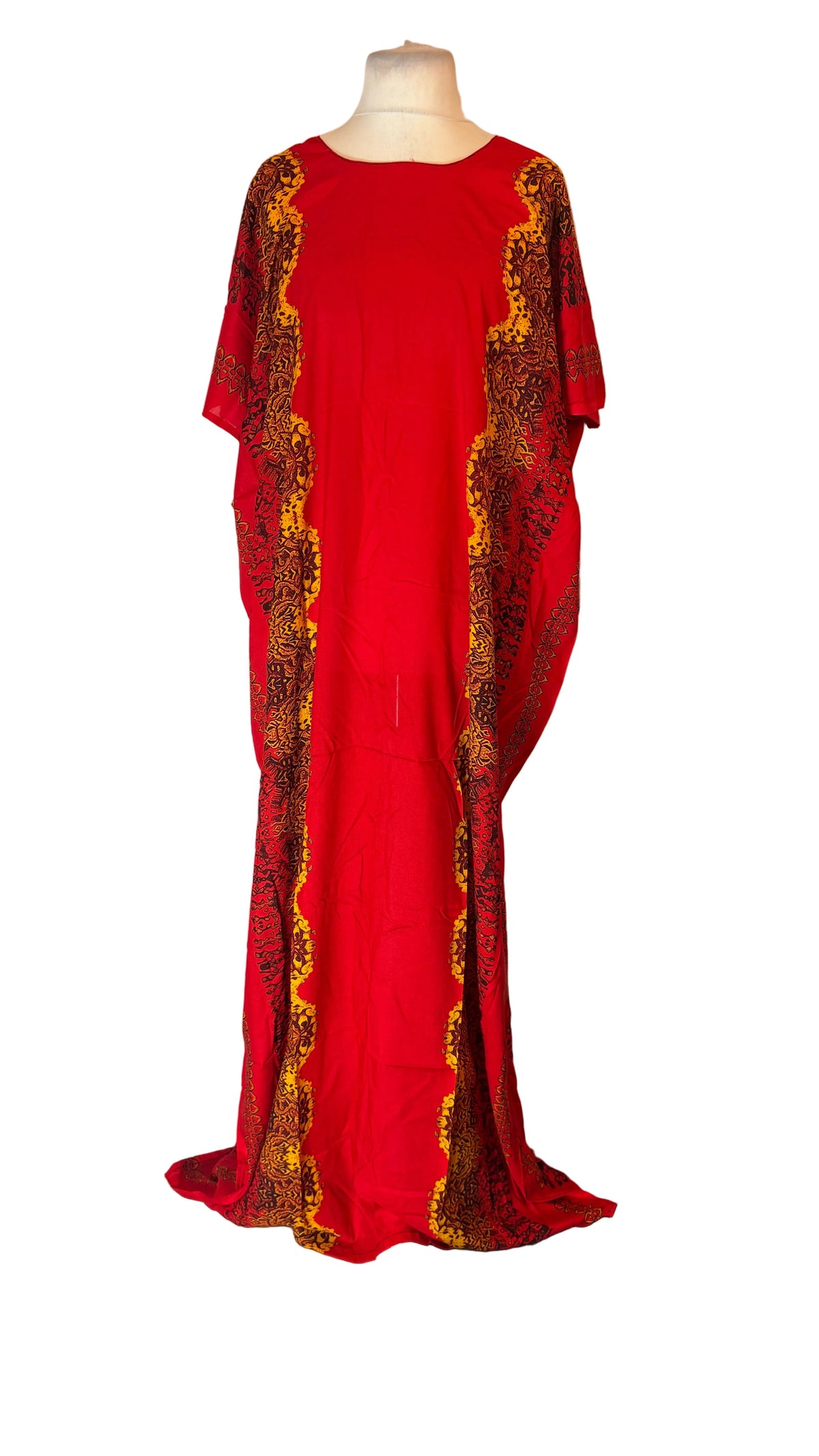 A red Somali Baati dress with yellow and black patterned trim, displayed on a mannequin in front of a white fabric backdrop.