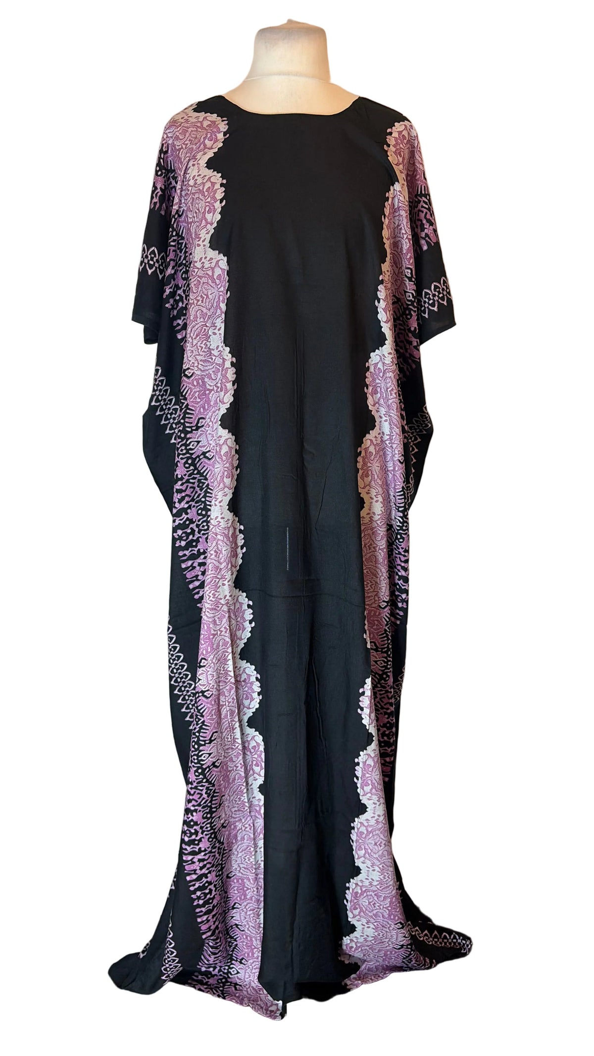 A long black Somali Baati dress with purple and silver patterned side panels, displayed on a mannequin in front of a white fabric backdrop.