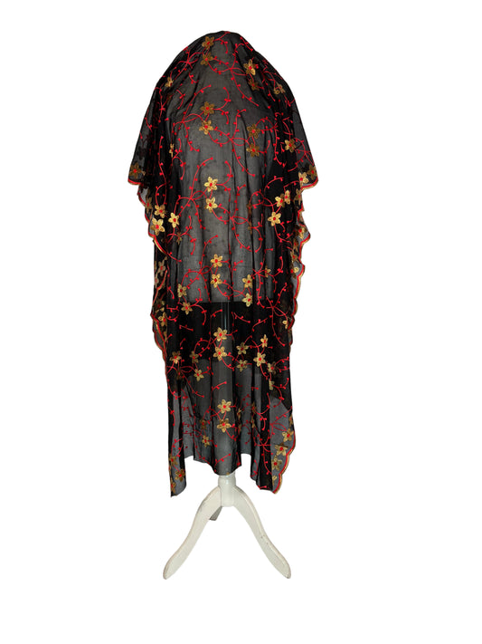 Somali Black and red with floral patterns on a white surface