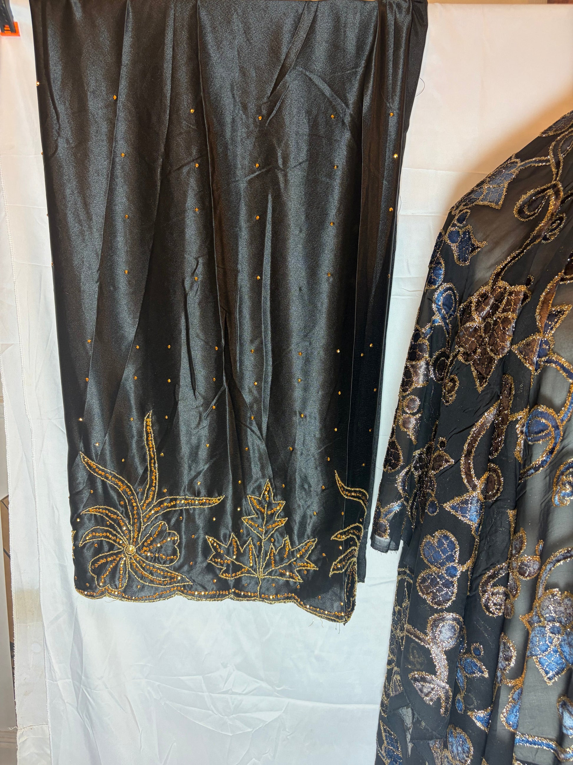 Black embroidered fabric on a white background